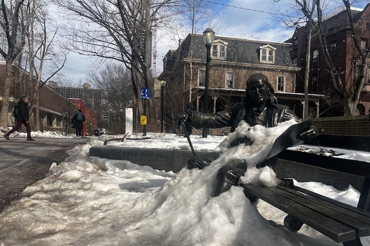 The statue of Ben Franklin on the University of Pennsylvania's campus, covered in snow on Wednesday, Feb. 11, 2026. Philadelphians are enjoying the warmer weather after weeks of freezing temps.