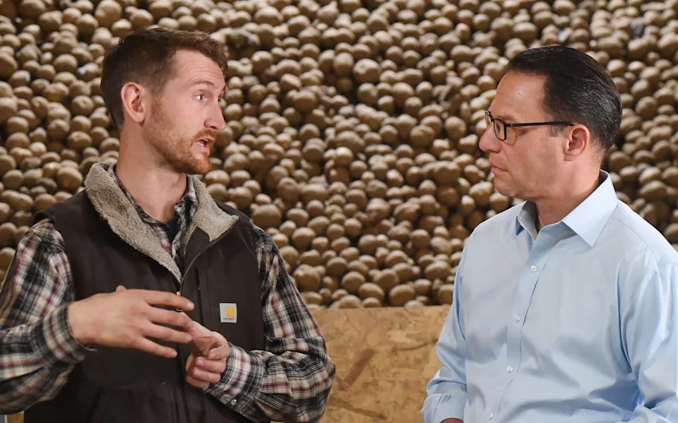 Zachary Troyer, left, Co-Founder of Folkland Foods talks with Pennsylvania Governor Josh Shapiro during a tour to announce a major investment in the organic french-fry plant in Waterford Township on Oct. 23, 2024. Shapiro praised the Troyers for their job growth during his budget address on Feb. 3.