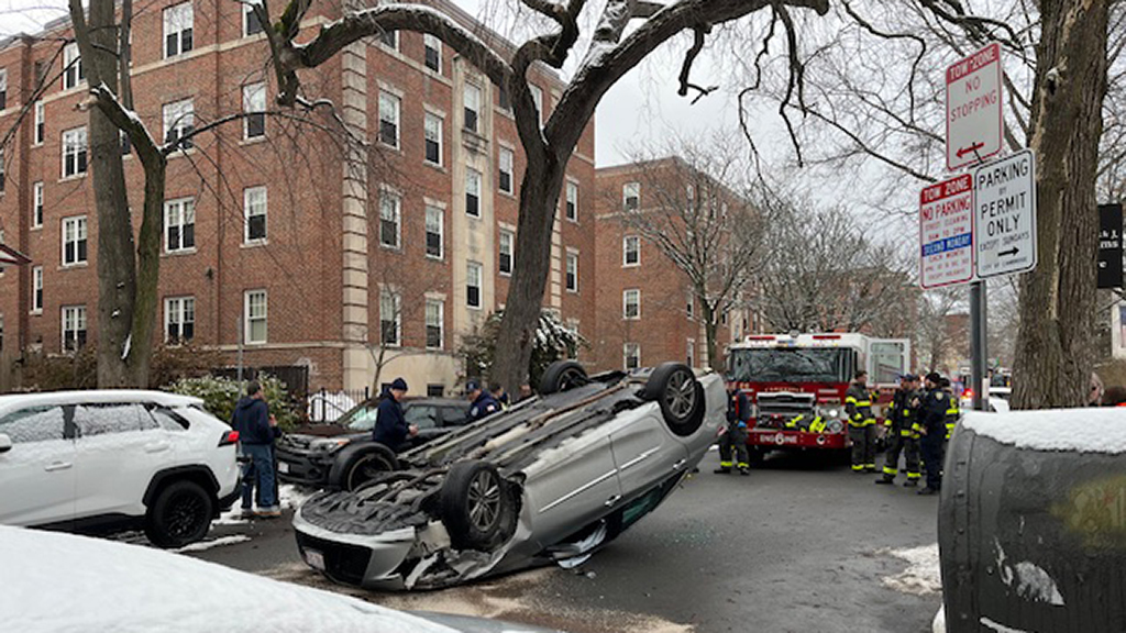Car flips over at intersection of Magazine and Erie