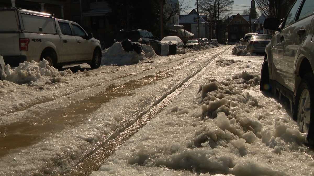 Ice piles up on Farragut Street in Pittsburgh’s Highland Park after water main break