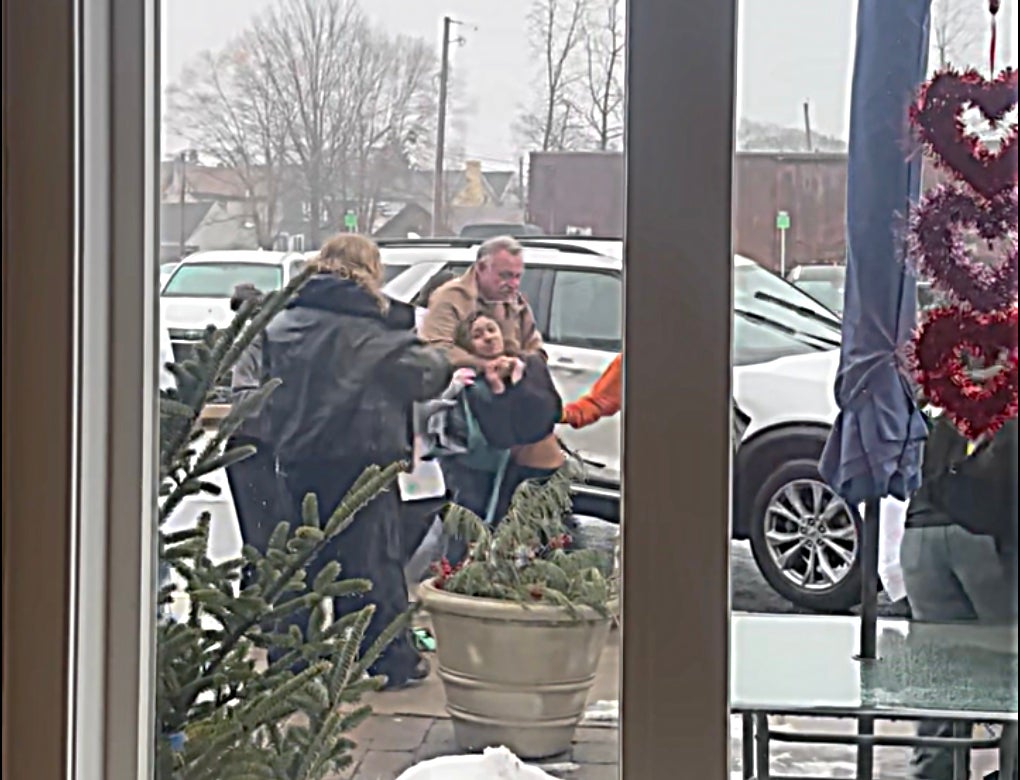 A man is seen in this image taken from video placing someone in a chokehold during a confrontation between Quakertown police and a group of students who were protesting U.S. Immigration and Customs Enforcement actions Friday morning.