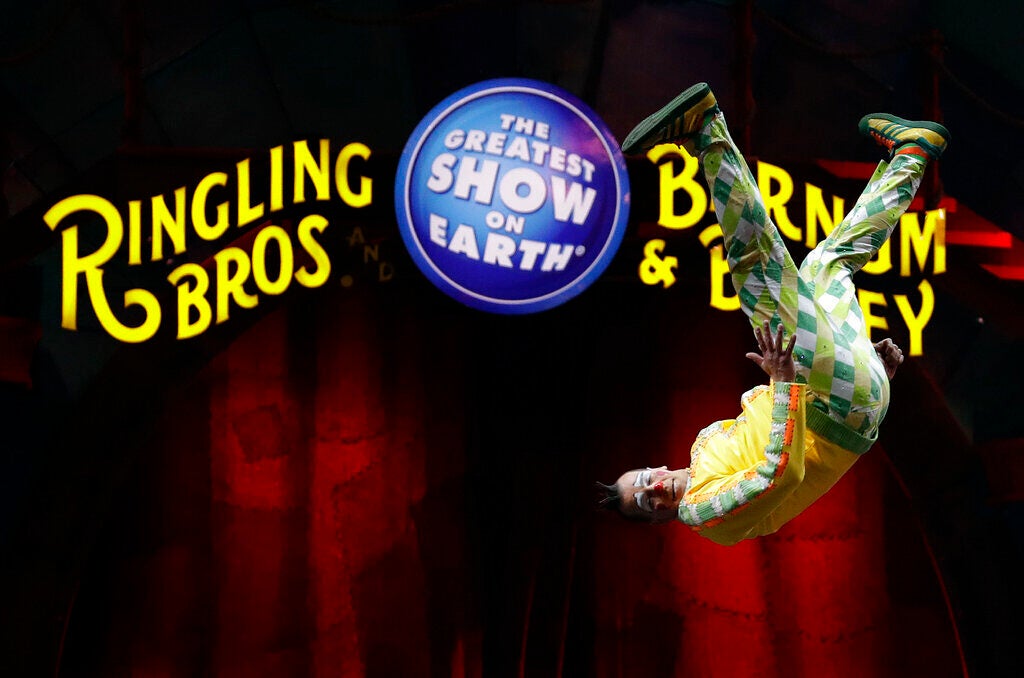 A Ringling Bros. and Barnum & Bailey clown does a somersault