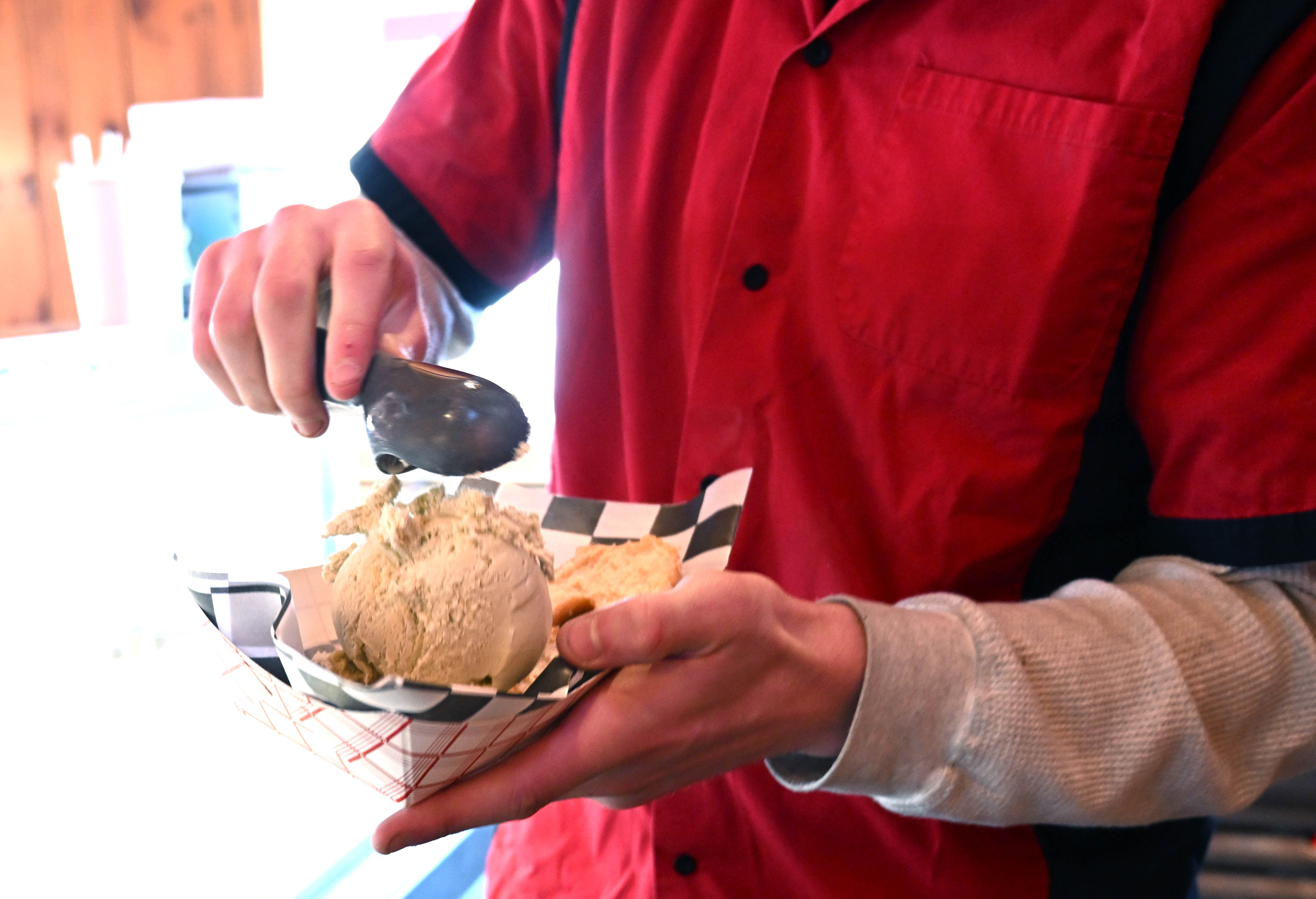 Dylan Garcia creates a doughnut sundae Saturday, Feb. 7, 2026,...
