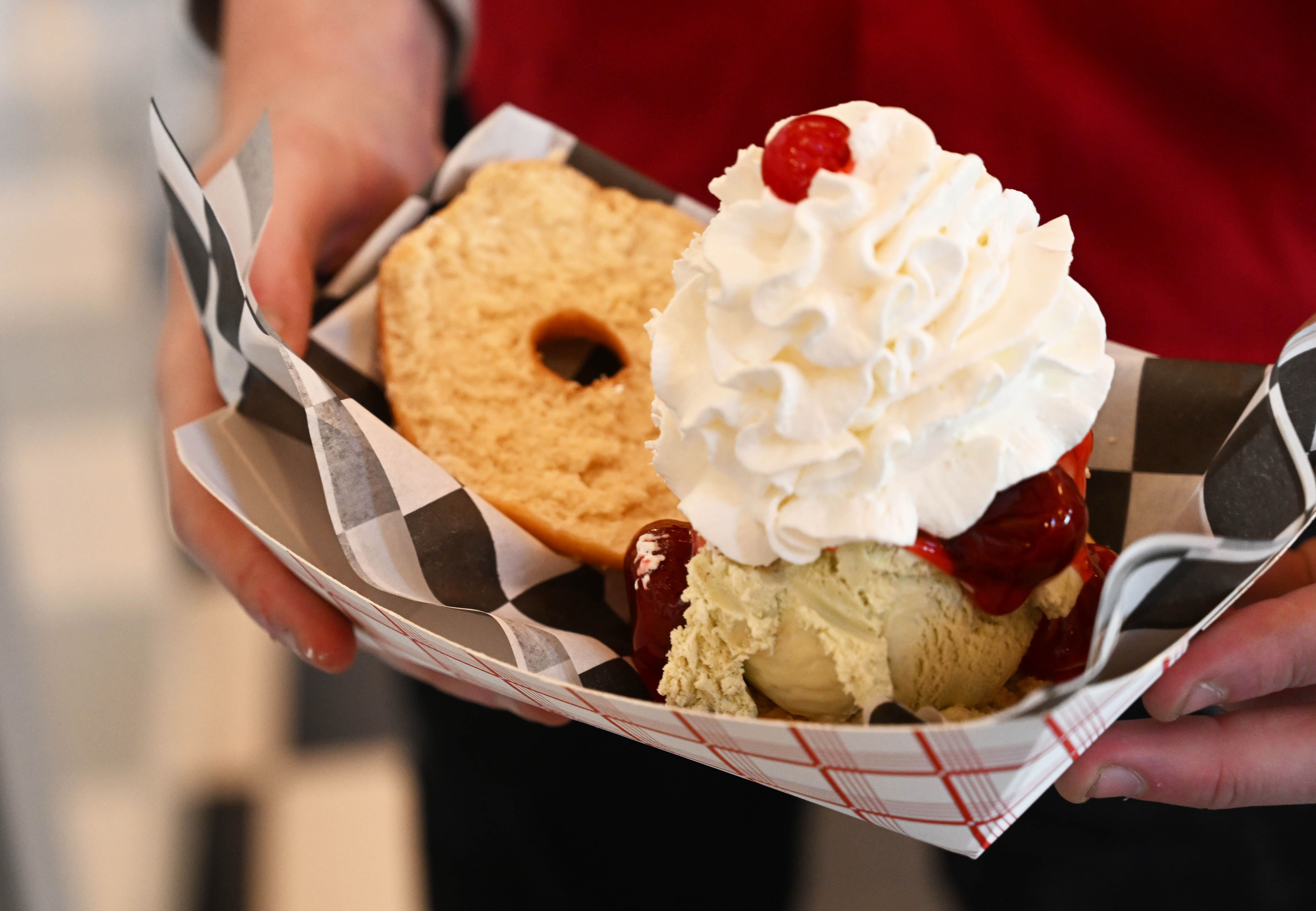 Dylan Garcia creates a doughnut sundae Saturday, Feb. 7, 2026,...