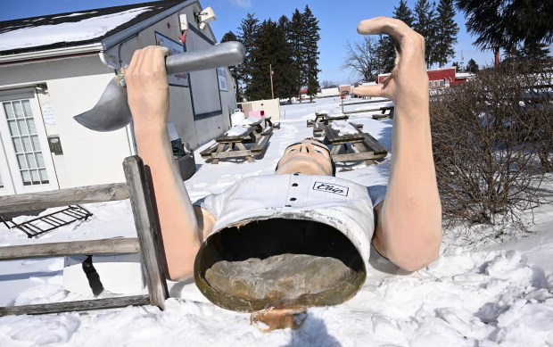 Chip," the statue outside of Coopersburg's Inside Scoop, split in half during the severe cold and strong winds Saturday, Feb. 7, 2026. The fiberglass statue was made from the model of a Muffler Man statue, copies of which were placed at businesses all over North America in the mid-1900s. Inside Scoop's statue was formed from a Muffler Man originally put up outside a Calgary, Canada, gas station in the 1960s, that in 2017 was discovered in a Canadian junk yard. (Amy Shortell/The Morning Call)