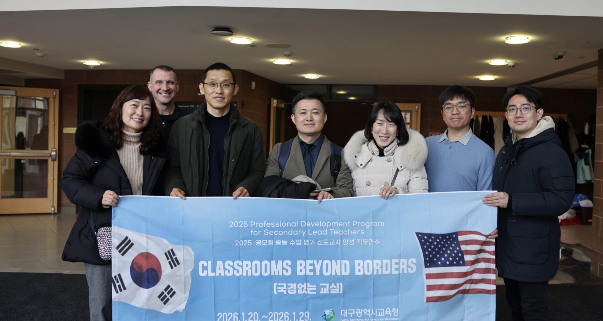 group holding banner