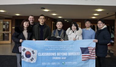 group holding banner