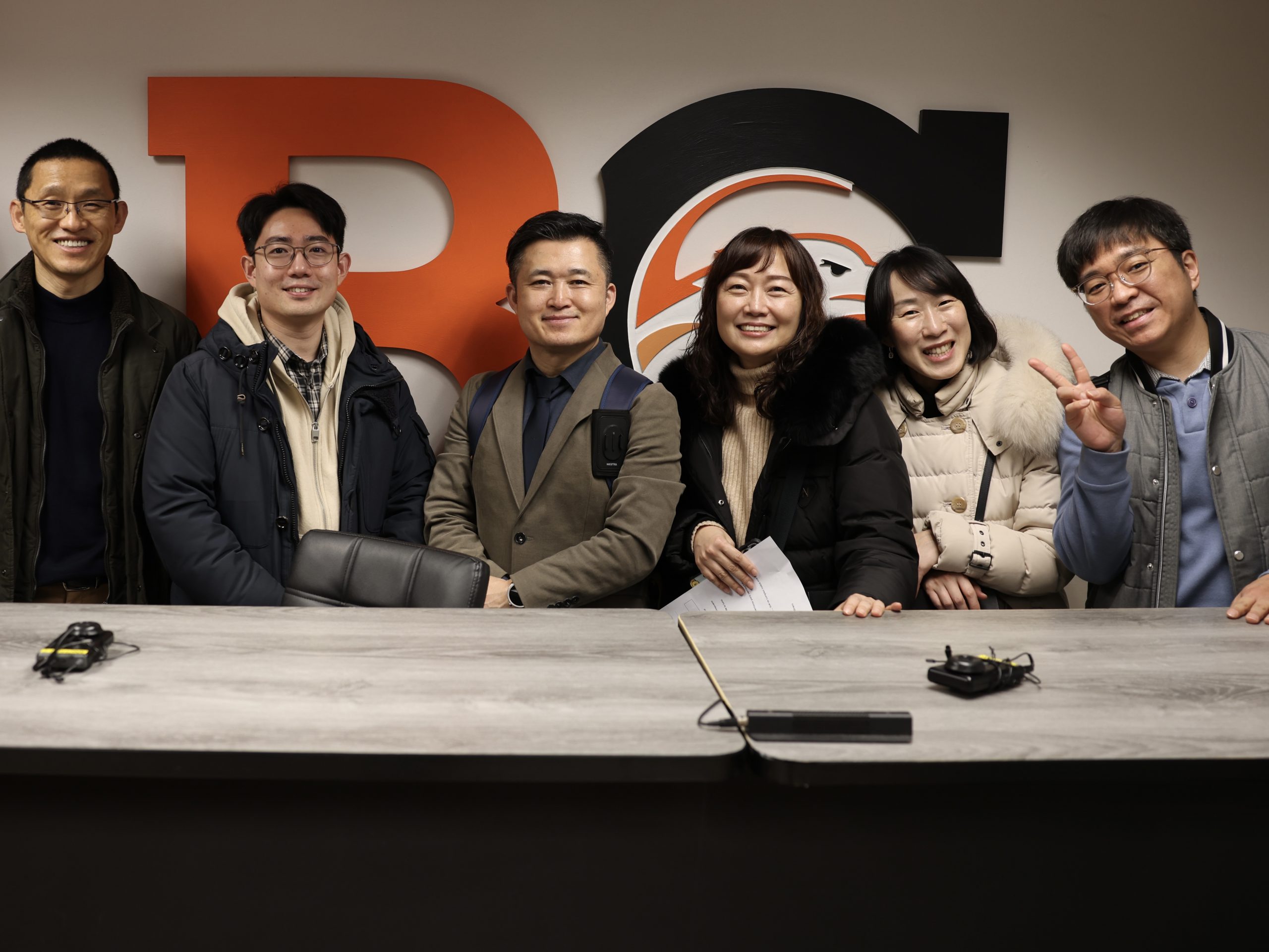 group of people poses for photo