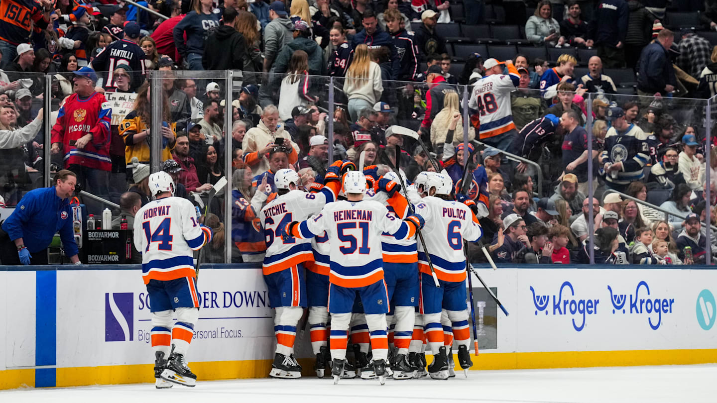 Feb 28, 2026; Columbus, Ohio, USA;  New York Islanders right wing Simon Holmstrom (10) celebrates with teammates after scoring the game-winning goal against the Columbus Blue Jackets in the overtime period at Nationwide Arena. Mandatory Credit: Aaron Doster-Imagn Images