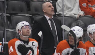 Mar 2, 2026; Toronto, Ontario, CAN; Philadelphia Flyers head coach Rick Tocchet (center) looks up at the scoreboard during a game against the Toronto Maple Leafs at Scotiabank Arena. Mandatory Credit: John E. Sokolowski-Imagn Images