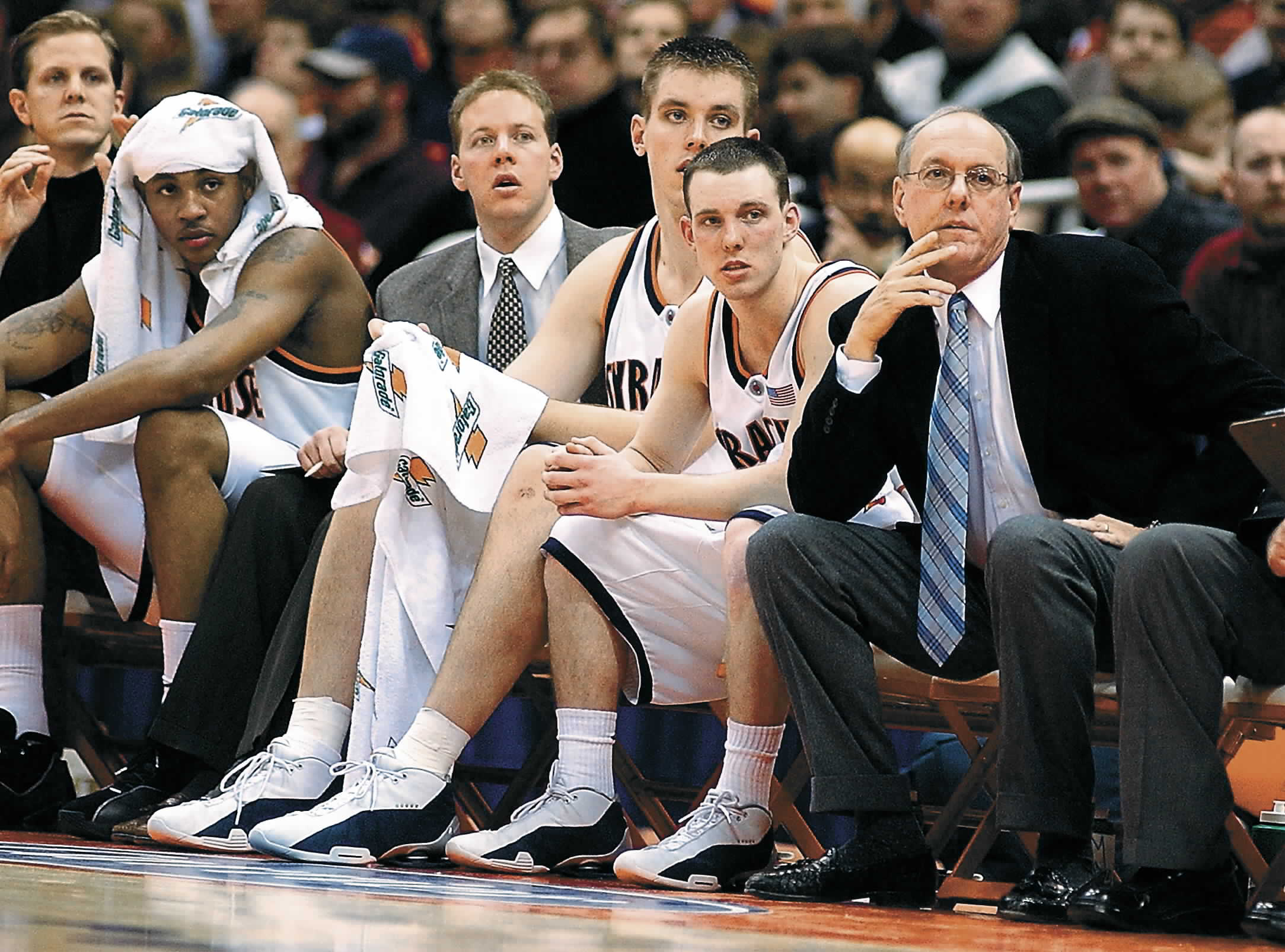 Gerry McNamara watches from the bench next to Syracuse coach...