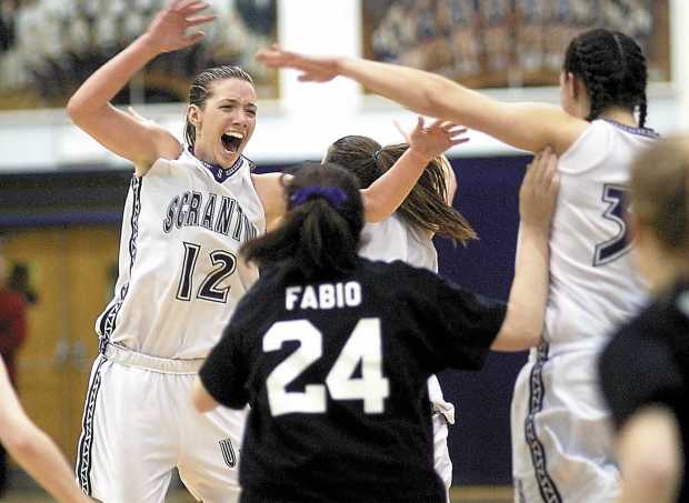 University of Scranton's Taryn Mellody (12) celebrates with teammates Michelle Fabio (24) and Maura Kane (33) after their win over Bowdoin College on March 13, 2005. (TIMES-TRIBUNE FILE)