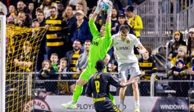 Pittsburgh Riverhounds goalkeeper Nico Campuzano elevates to catch the ball in front of Steel City FC's Nick Graeca in the Hounds' 2-1 win in the U.S. Open Cup First Round on March 25, 2026 at Highmark Stadium in Pittsburgh. (Photo: Chris Cowger/Riverhounds SC)