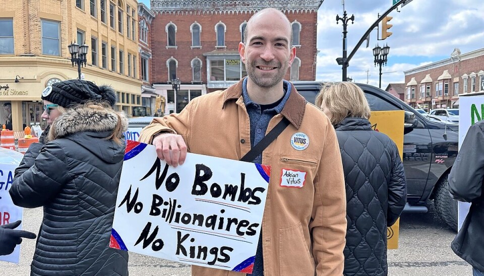 Protester with sign at a rally.