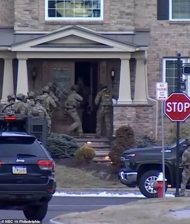 At least 10 federal agents stormed the $2.25 million home in Newtown where Kayumi lived on Sunday. One man was detained at the property