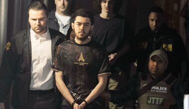 Ibrahim Kayumi (front) and Emir Balat (back) in federal custody leaving the NYPD's 26th Precinct stationhouse in Manhattan on Monday