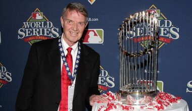 Philadelphia Phillies Hall-of-Fame Broadcaster Harry Kalas is pictured next to the Commissioner's Trophy after the team's 2008 World Series victory