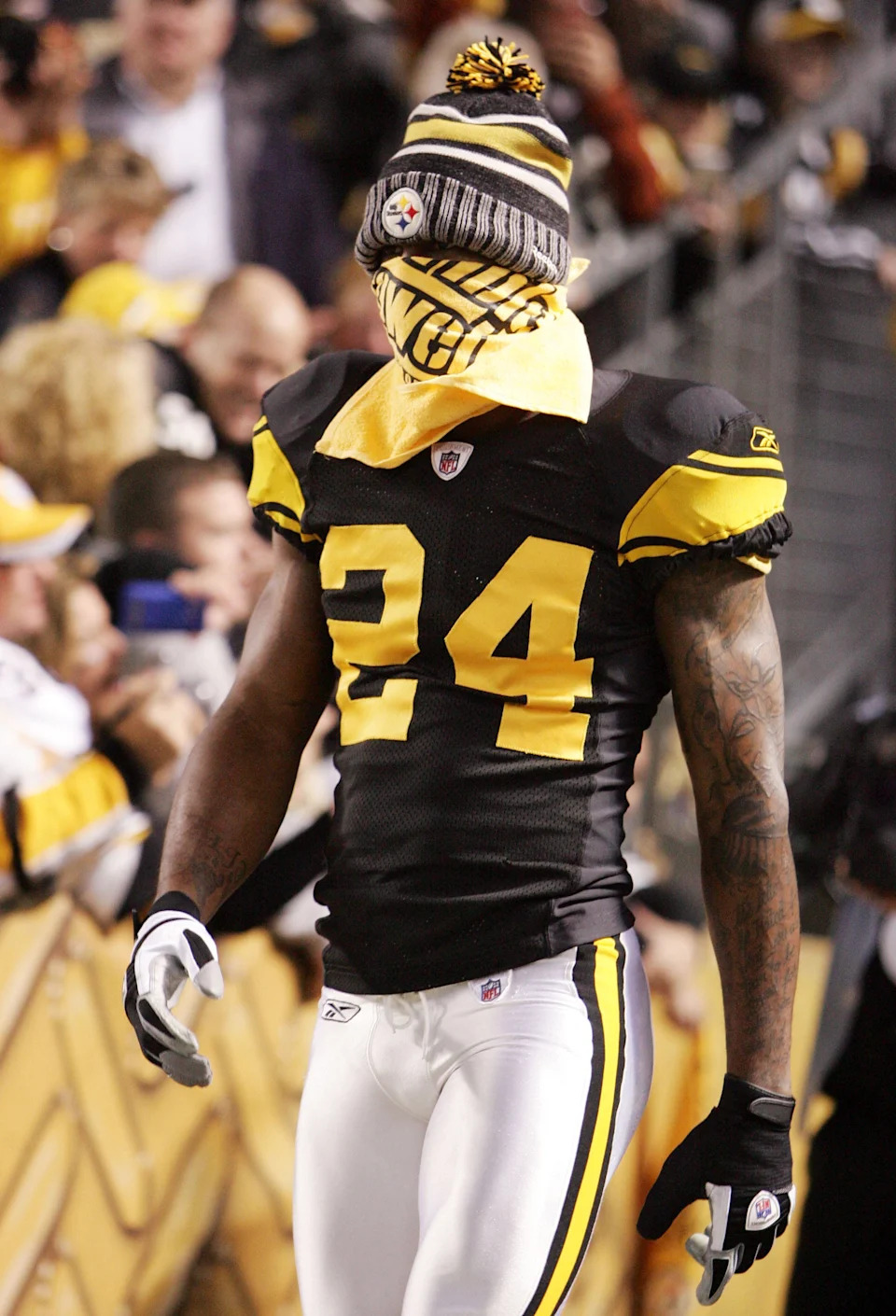 November 6, 2011; Pittsburgh,PA, USA: Pittsburgh Steelers defensive back Ike Taylor (24) takes the field with his face covered in a Terrible Towel during the first quarter against the Baltimore Ravens at Heinz Field. The Ravens won 23-20. Mandatory Credit: Charles LeClaire-USPRESSWIRE