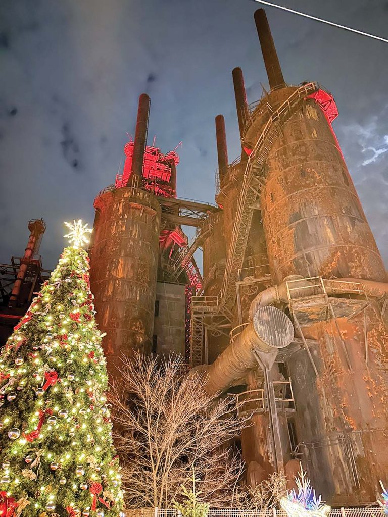 A christmas tree next to a building