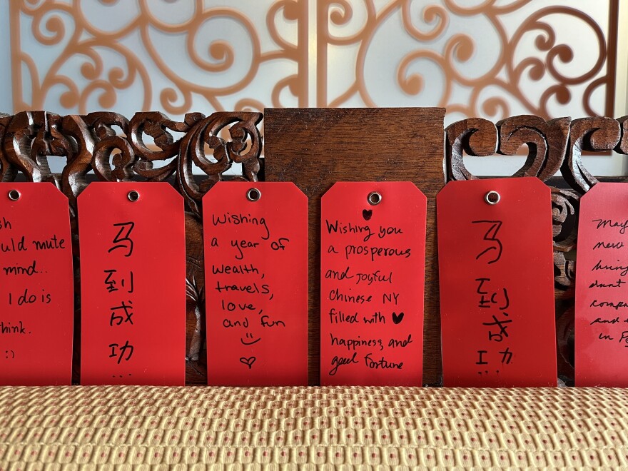 Red tags with handwritten wishes