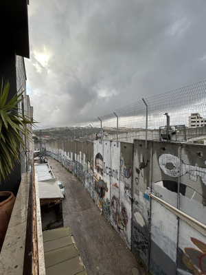 Dark sky over the bleak Separation Wall  surrounding Bethlehem - ICN/JS