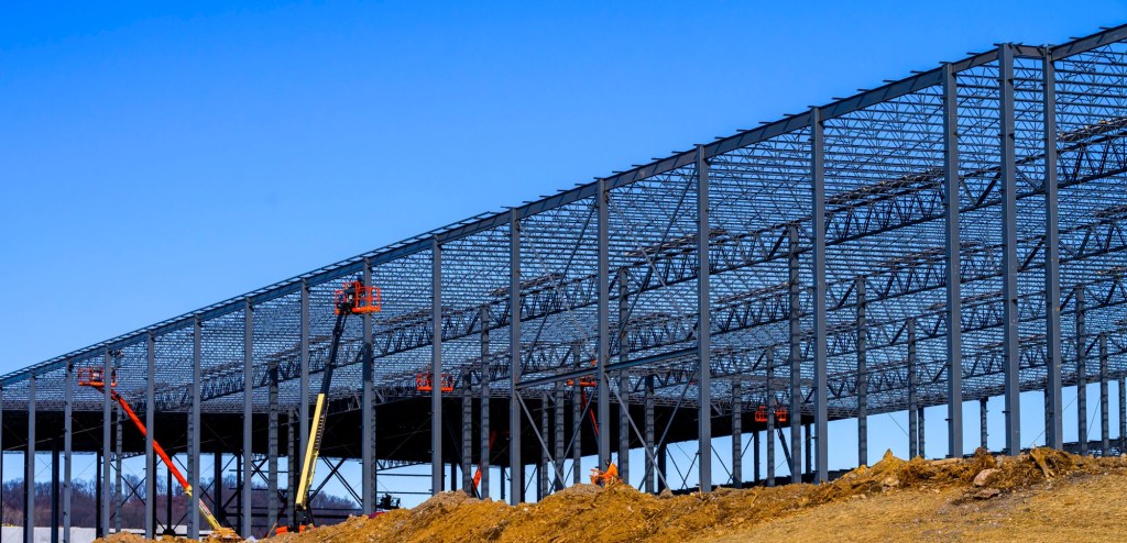 Construction continues on an industrial building photos