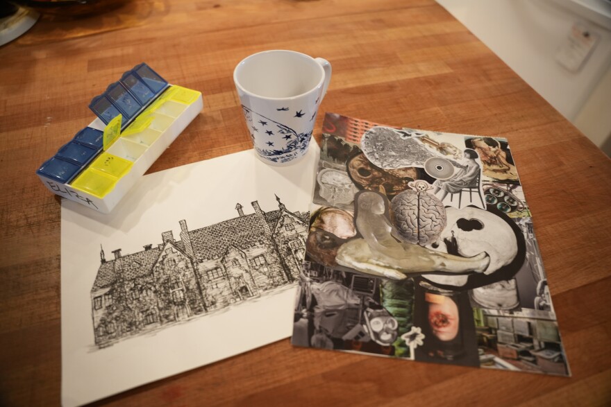 A prescription organizer sits next to an illustration and a collage. 