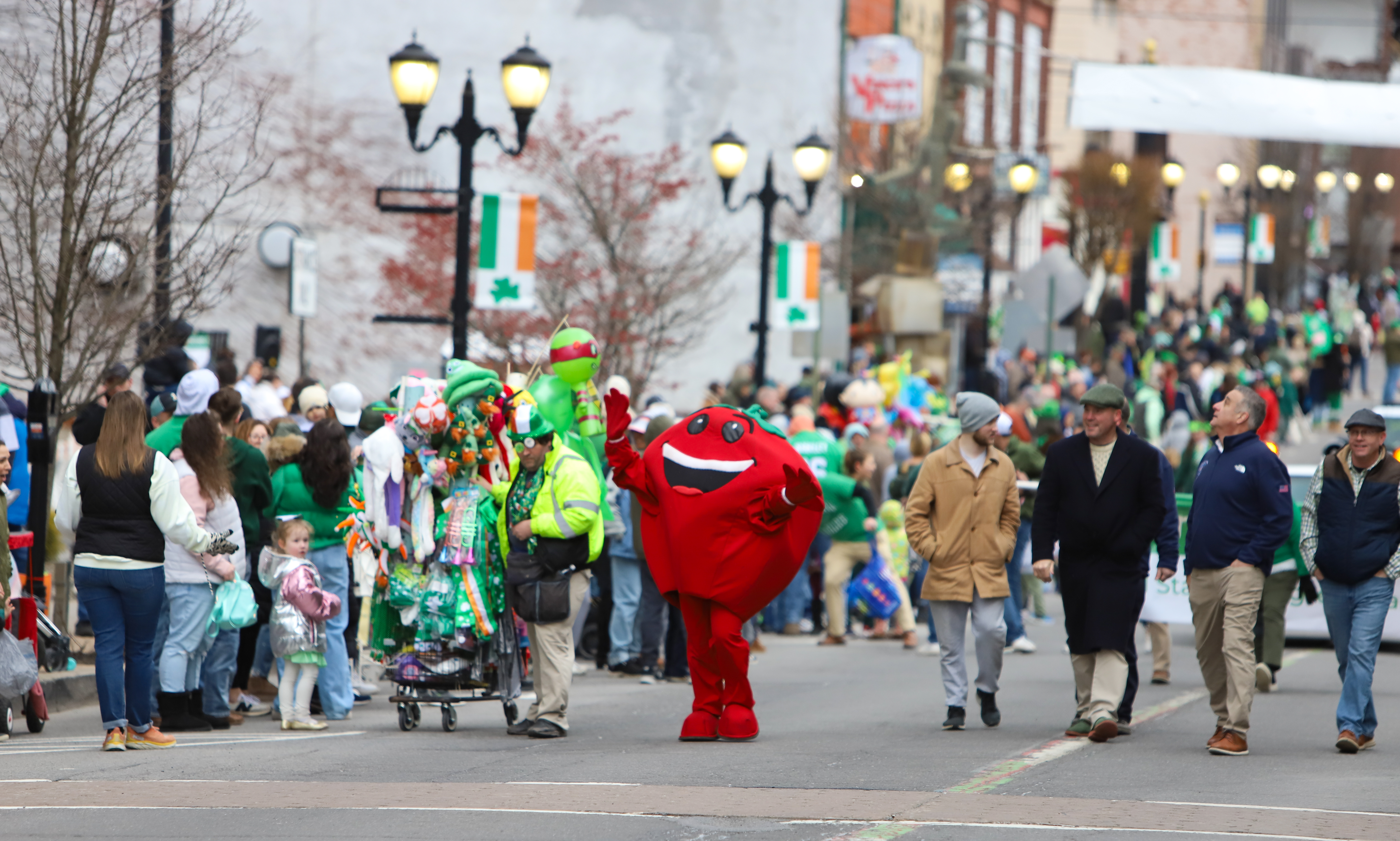 The Pittston tomato mascot greets parade goers during the 12th...