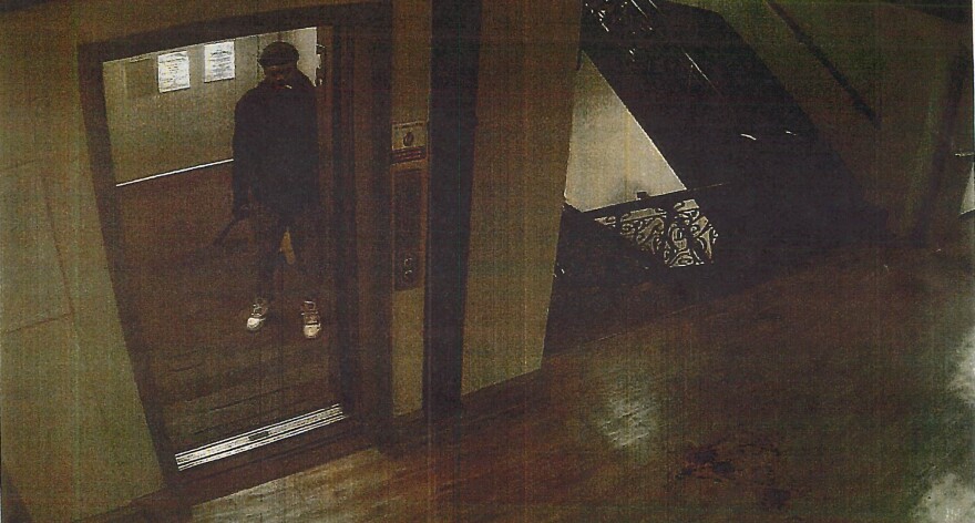 Police say this photo taken from a hallway surveillance video shows Michael Woods standing in an elevator smoking and holding the machete he used to kill two women and seriously injure another Dec. 9,2026 in the Jermyn Apartments in Scranton.