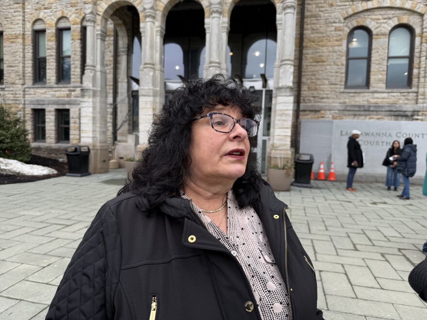Theresa Fagerlin speaks outside the Lackawanna County Courthouse on March 6, 2026, to reporters who asked her about her friend, Linda Fortuna. Fagerlin had just attended a preliminary hearing for Michael Woods, who is accused of killing Fortuna and Terry Muller and seriously wounding Marilyn Waller inside the Jermyn Apartments on Dec. 9, 2025.