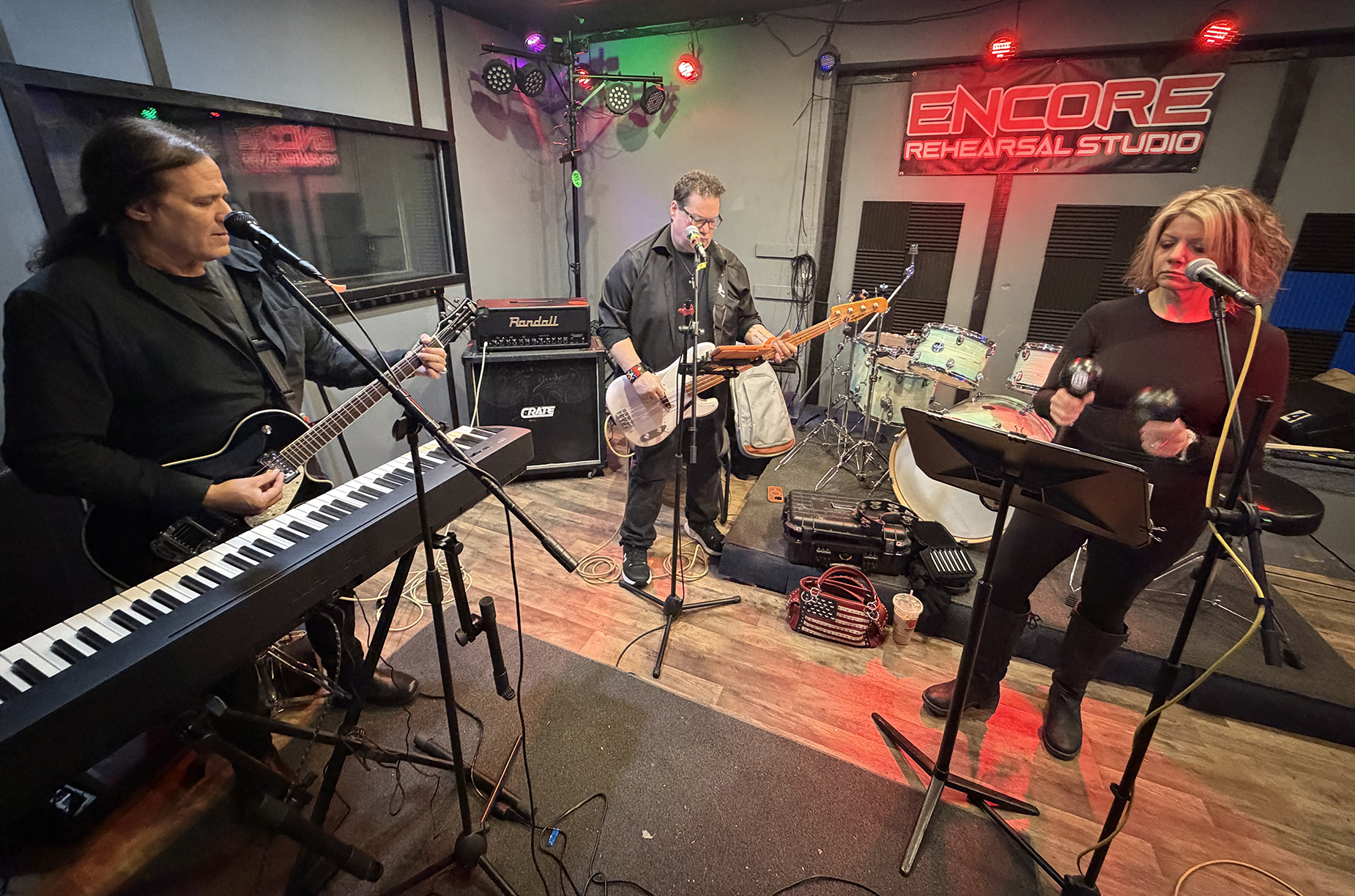 Dr. Stephen Eskin, left, and professional musicians Keith White and...