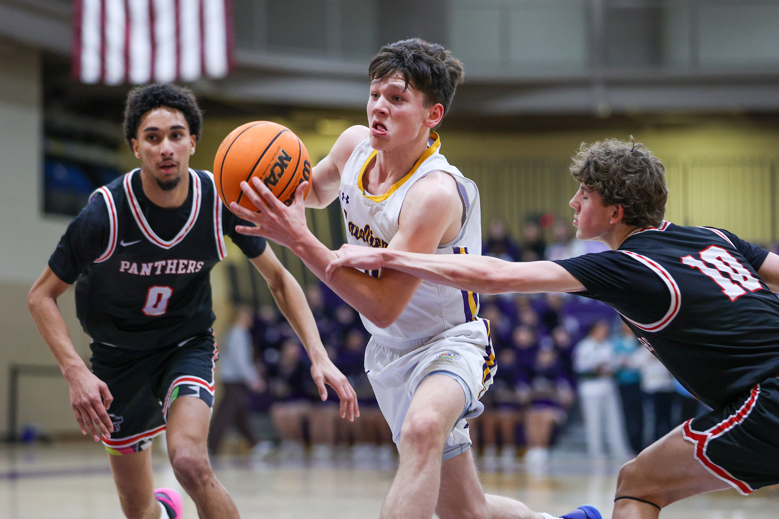 Scranton Prep’s Chicky Skoff (0) drives through Schuylkill Valley defenders...