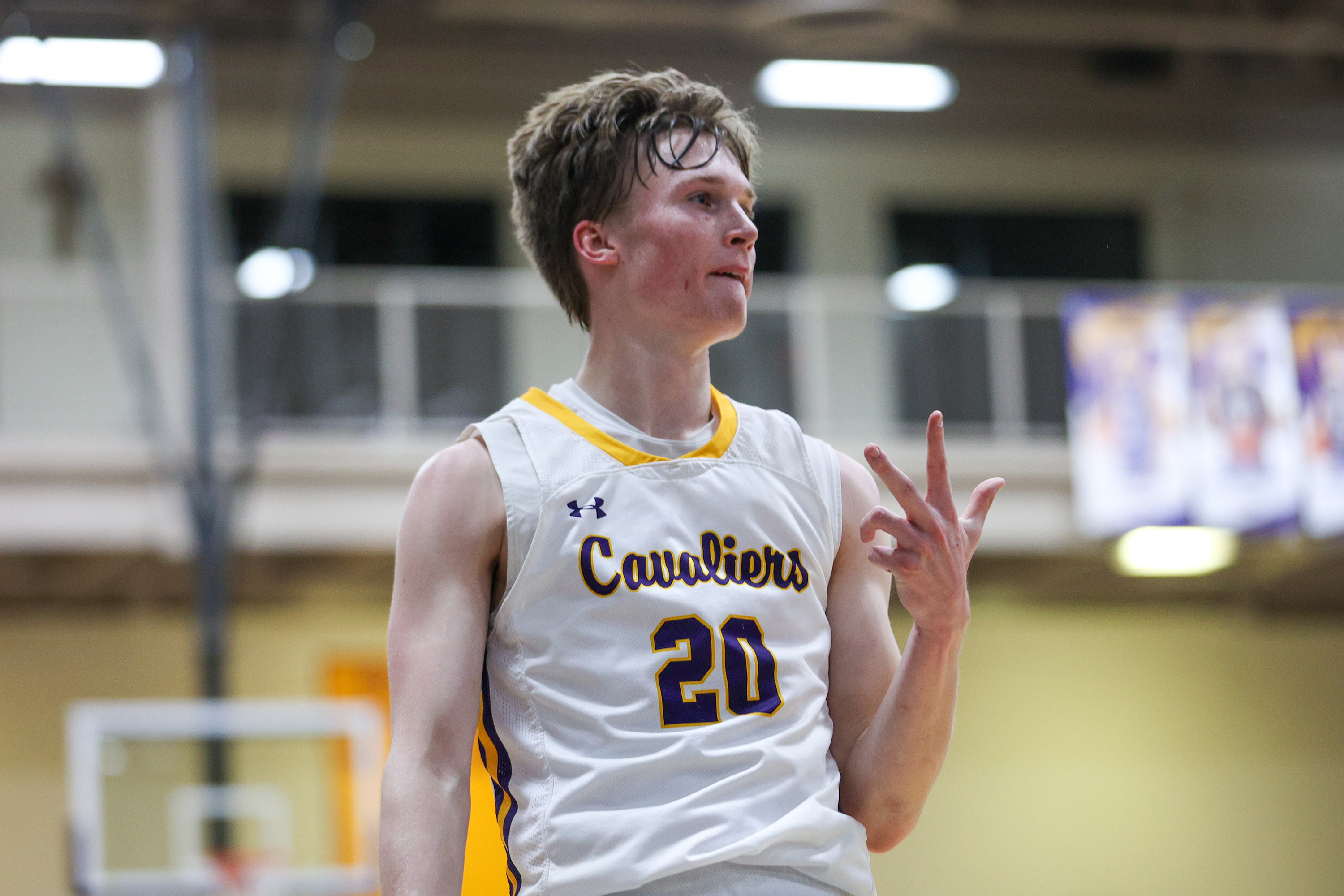 Scranton Prep’s Packy Doherty (20) celebrates after making a three-pointer...