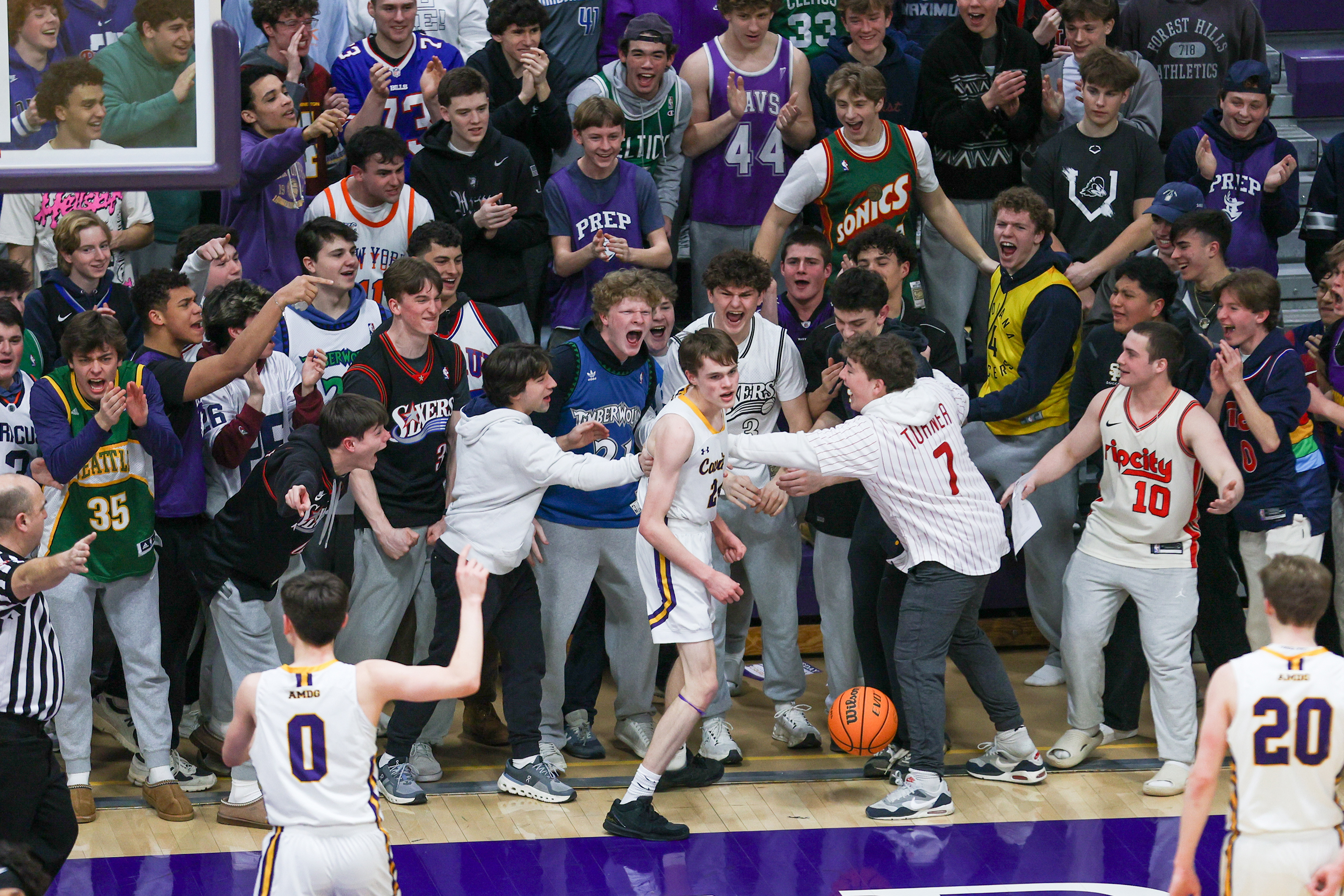 Scranton Prep’s student section celebrates after Charlie Skoff (24) dunks...