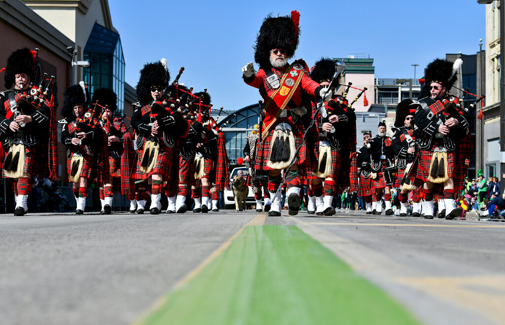 The Penn York Highlanders Bagpipe Band from Athens march down...