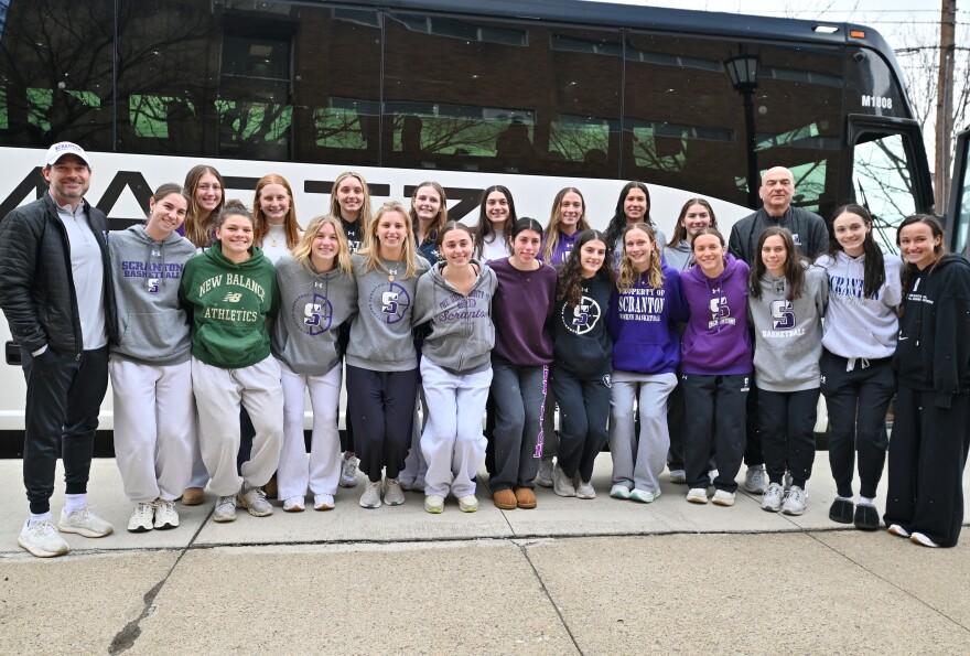 The University of Scranton women's basketball team and coaches pose for a photo before leaving for the Final Four.