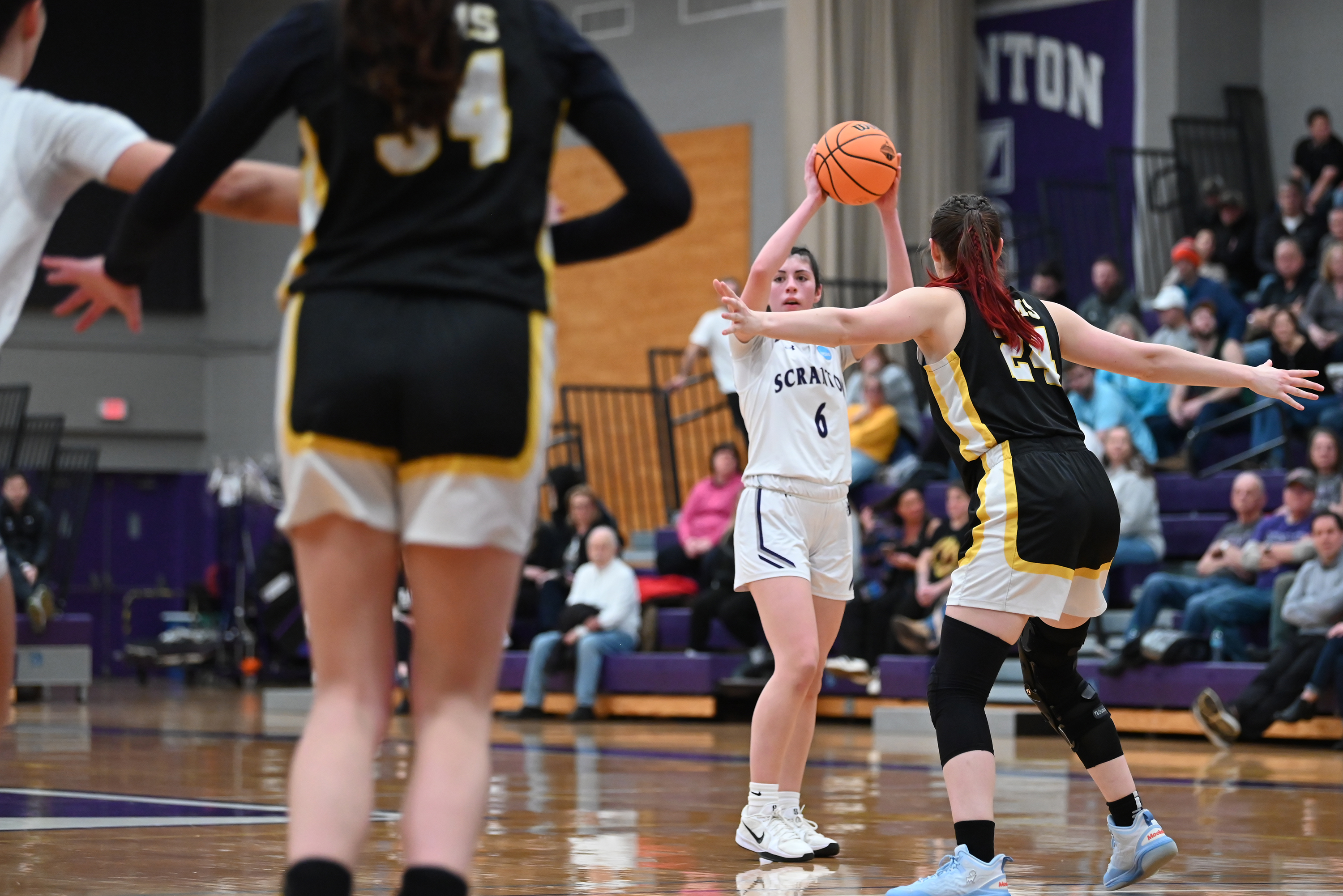 Framingham State’s Kelsey Yelle defends University of Scranton’s Kaitlyn Raguso...
