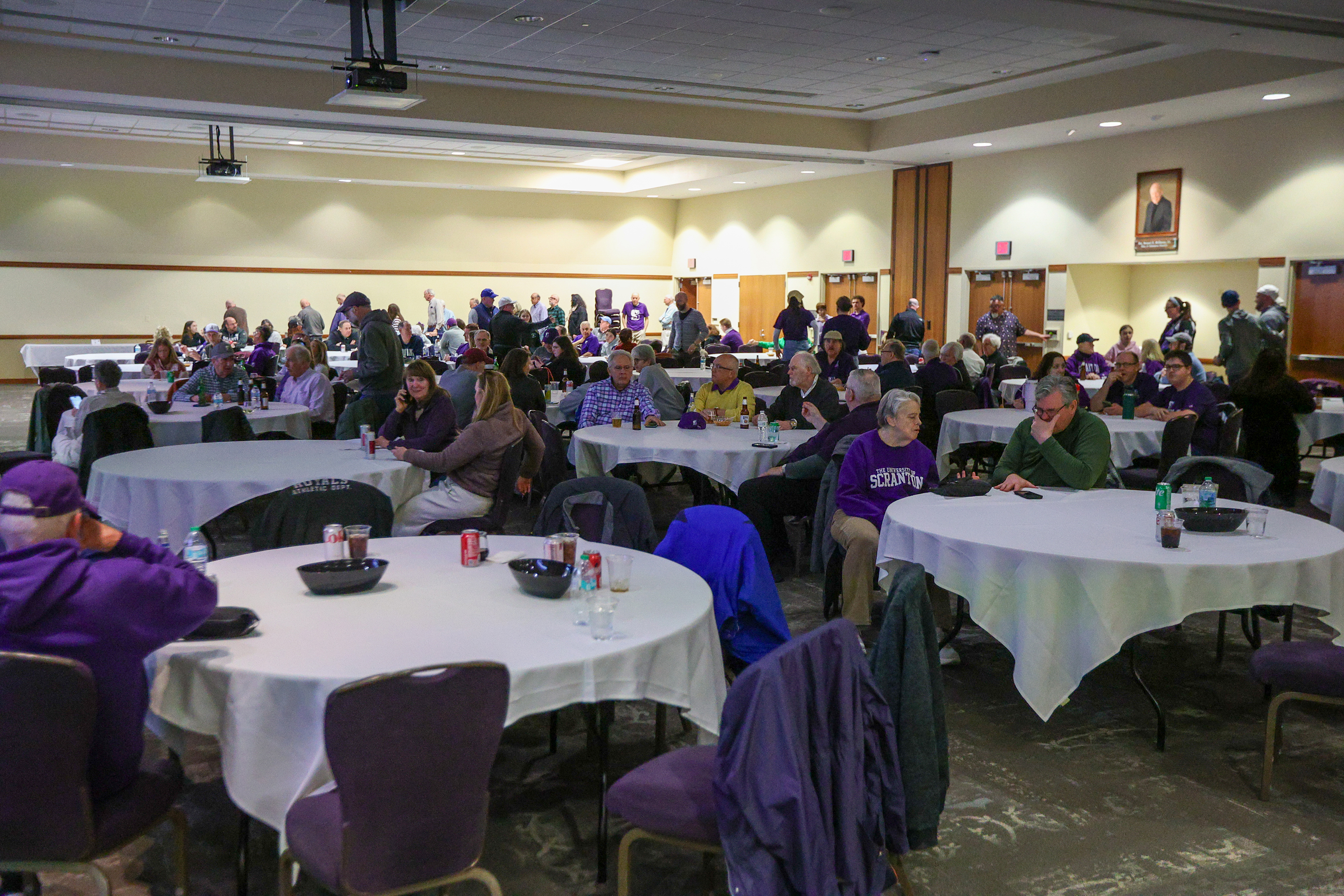 Attendees gather and wait for the game to start during...