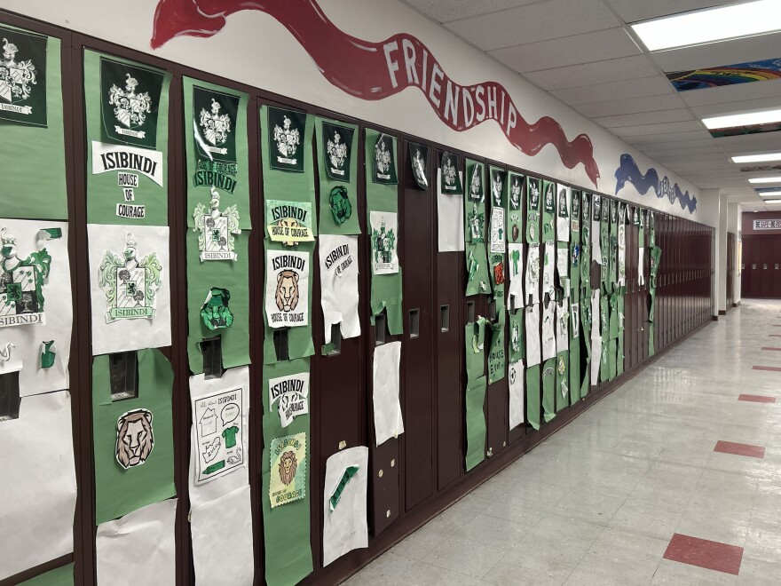 Papers decorate school lockers.