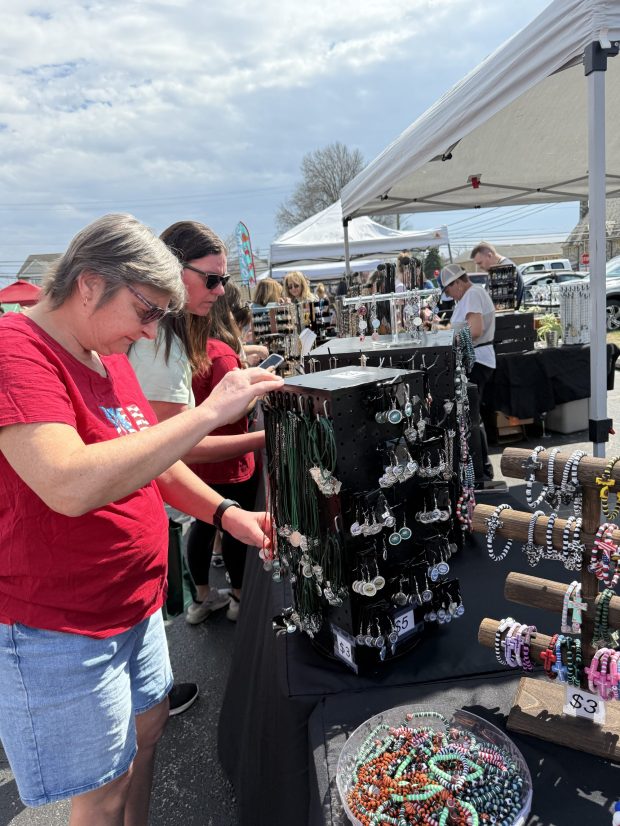 Patty Jo Urian, front, of Folsom, and Katie Schwindt, back, of Aldan, look through jewelry at a vendor booth during the first-ever Folsom Italian Festival on Saturday. Dozens of vendors were on-site at the Folsom Firehouse property, displaying wares and selling food and merchandise. (PEG DEGRASSA/ DAILY TIMES)