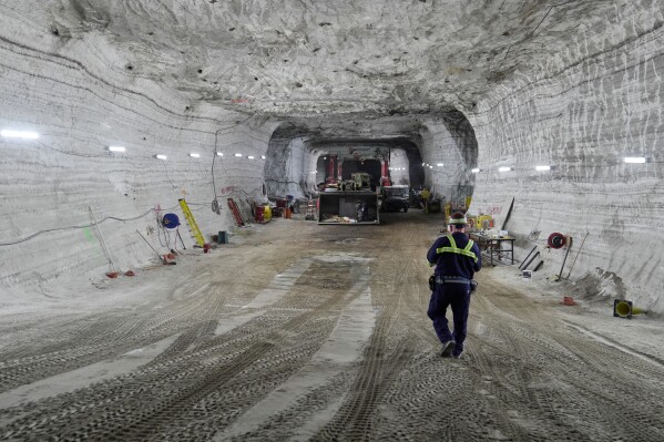 George Campbell, maintenance supervisor, walks down an incline in the shop at the Cargill salt mine on Whiskey Island in Cleveland, Ohio, Thursday, March 19, 2026. (AP Photo/Sue Ogrocki)