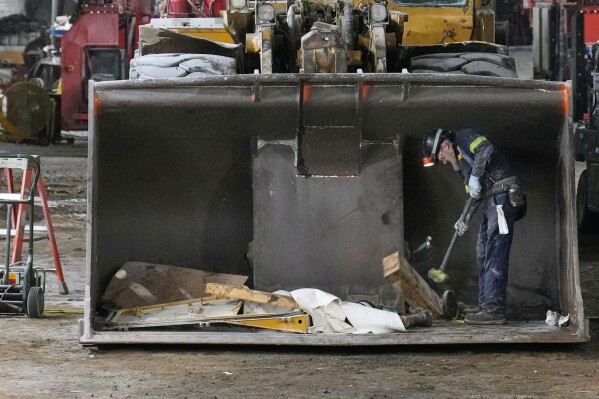 A worker repairs machinery used to muck the salt, in the shop at the Cargill salt mine on Whiskey Island in Cleveland, Ohio, Thursday, March 19, 2026. (AP Photo/Sue Ogrocki)