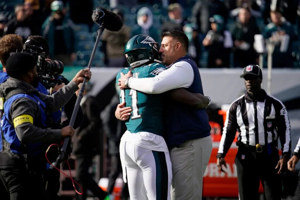 Tennessee Titans head coach Mike Vrabel hugs Philadelphia Eagles wide receiver A.J. Brown (11) as the teams get ready to face off at Lincoln Financial Field Sunday, Dec. 4, 2022, in Philadelphia, Pa. Nfl Tennessee Titans At Philadelphia Eagles