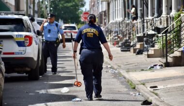 Crime scene investigators are pictured on the scene of a mass shooting Monday, July 7, 2025, on Etting Street in Grays Ferry. Law enforcement officials believe a gun with a switch was used.