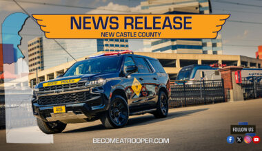 Graphic titled “News Release New Castle County” featuring a Delaware State Police Chevrolet Tahoe parked with Wilmington skyline and train station in the background. A silhouette map of Delaware appears on the left with New Castle County highlighted in blue, the text “BecomeATrooper.com” on the bottom center, and social media icons are shown at the bottom right corner.