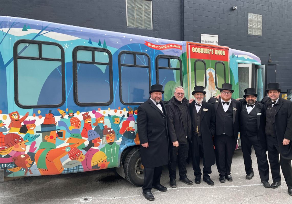 Carnegie artist Dave Klug decorates bus to bring Punxsutawney Phil to Pittsburgh's St. Patrick's Day Parade