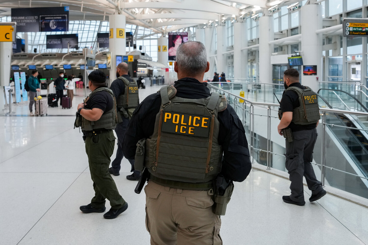 Immigration and Customs Enforcement (ICE) agents patrol at John F. Kennedy International Airport, New York City, March 23, 2026. Hundreds of Immigration and Customs Enforcement agents were ordered to deploy to airports to help fill TSA staffing gaps across the country.