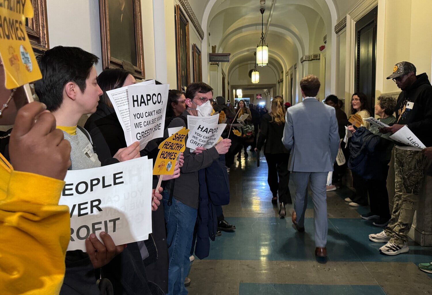 Protesters chant at City Hall in support of the Safe Healthy Homes Act.