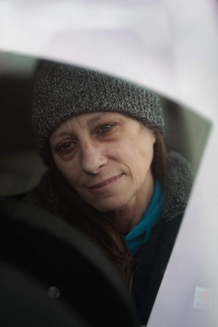 Kim Schaffner is seen from inside her car window