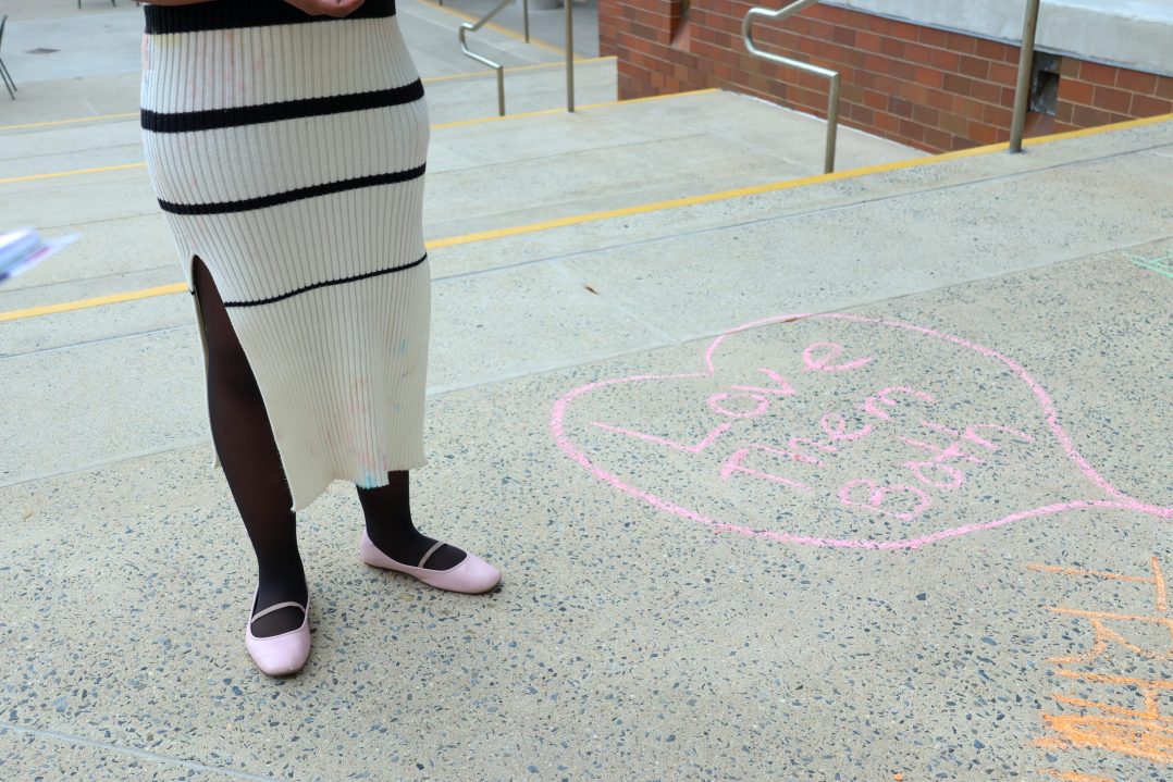 Rhema Hooper, '26, is pictured with a chalk-stained dress. Hooper is a co-president of the Students for Life club. (Max Randall/B&W Staff)